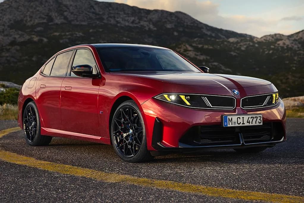 New BMW M350 xDrive sedan in red, front three-quarter view