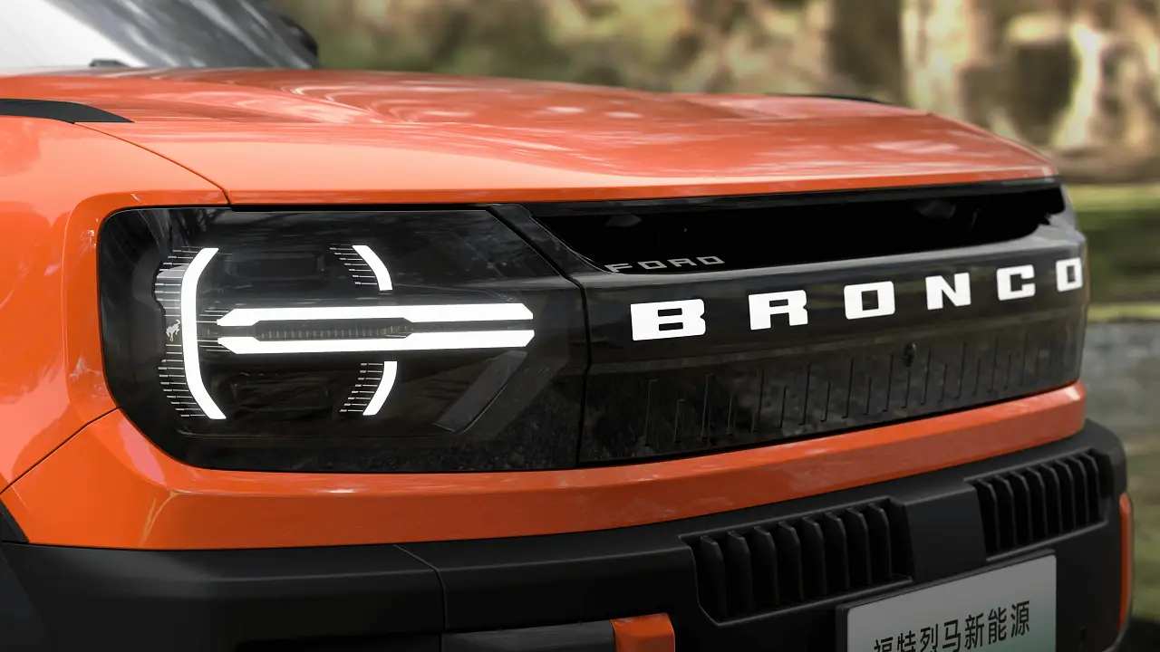Front detail of the Ford Bronco New Energy showing the illuminated Bronco lettering