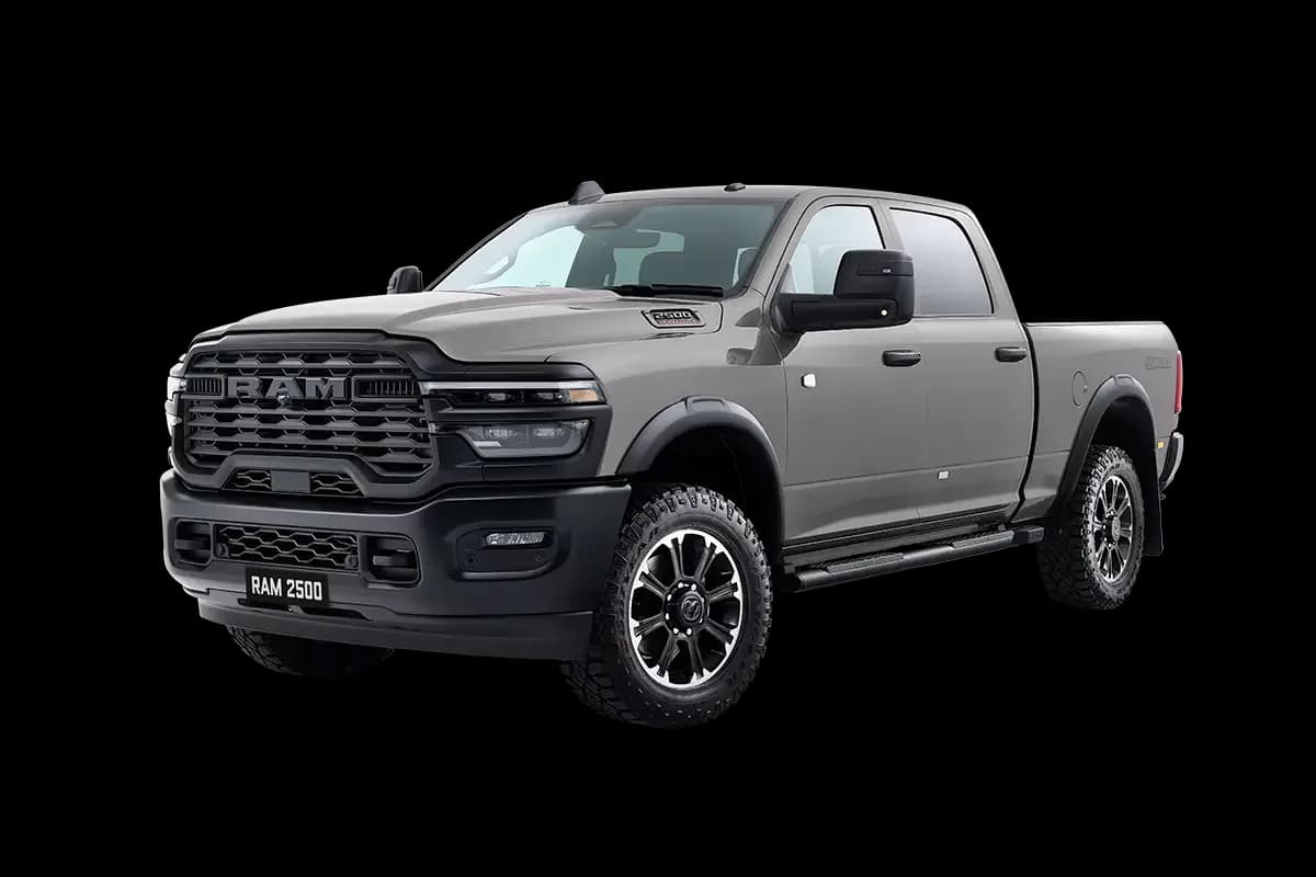 Ram 2500 Warlock Heavy Duty crew cab pickup in Ceramic Grey, front three-quarter studio view