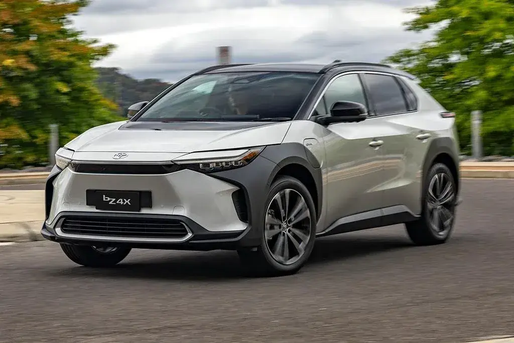 Toyota bZ4X AWD in silver on a coastal road