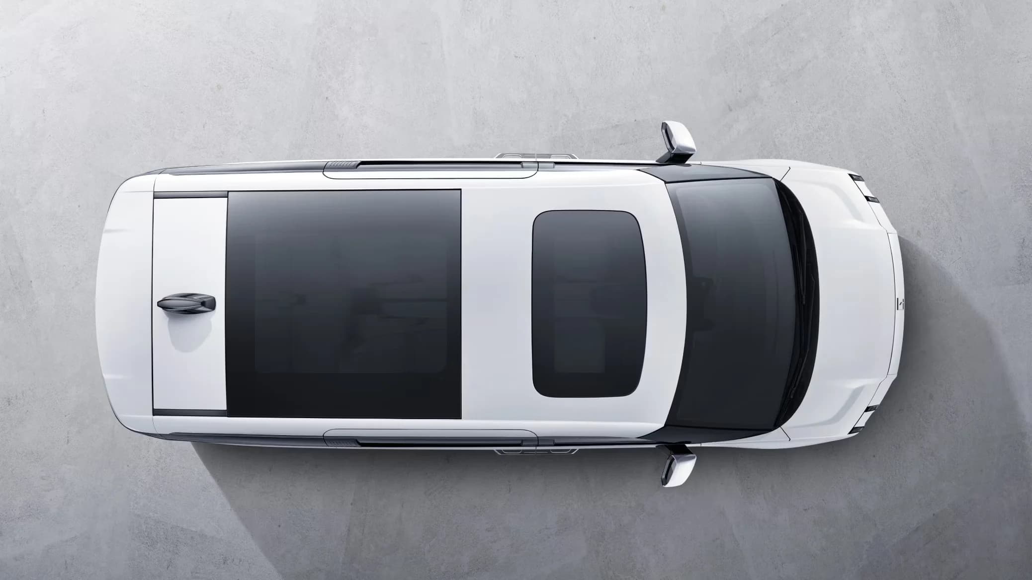 Zeekr 009 top-down view showing full-length panoramic glass roof