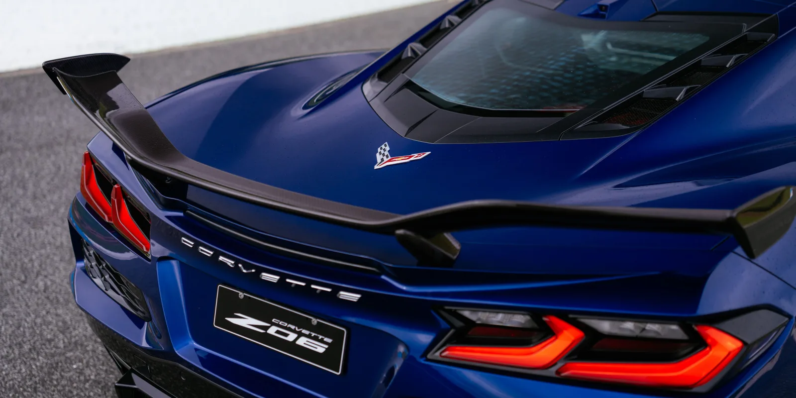 Rear deck of the 2027 Chevrolet Corvette Z06 showing the carbon-fibre high wing and tail lights