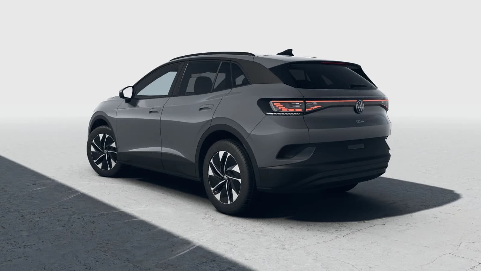 Model year 2027 Volkswagen ID.4 Pro in grey, rear three-quarter studio view