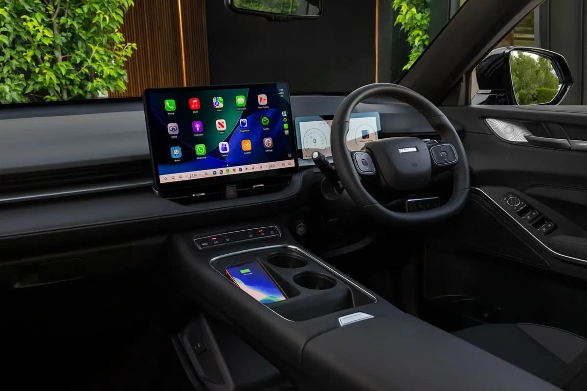 2026 GWM Haval H6GT Hi4 PHEV interior with 14.6-inch Coffee OS touchscreen and wireless phone charger