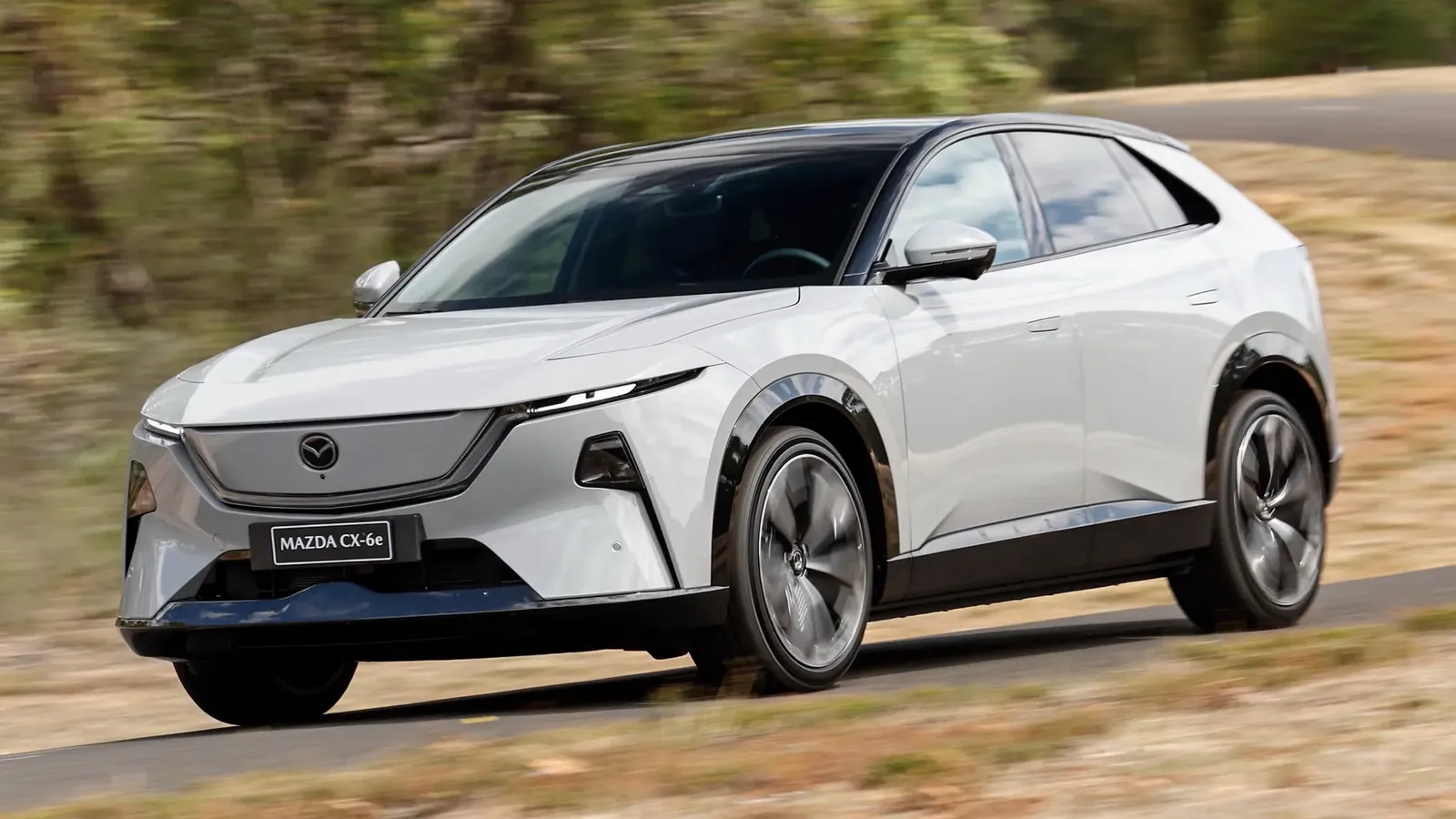 2026 Mazda CX-6e in white, front three-quarter driving shot