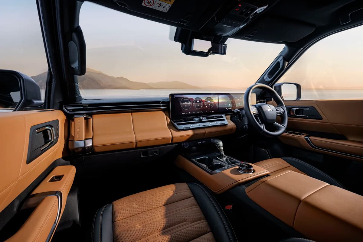All-new Mitsubishi Pajero dashboard with twin 14.3-inch screens and tan leather