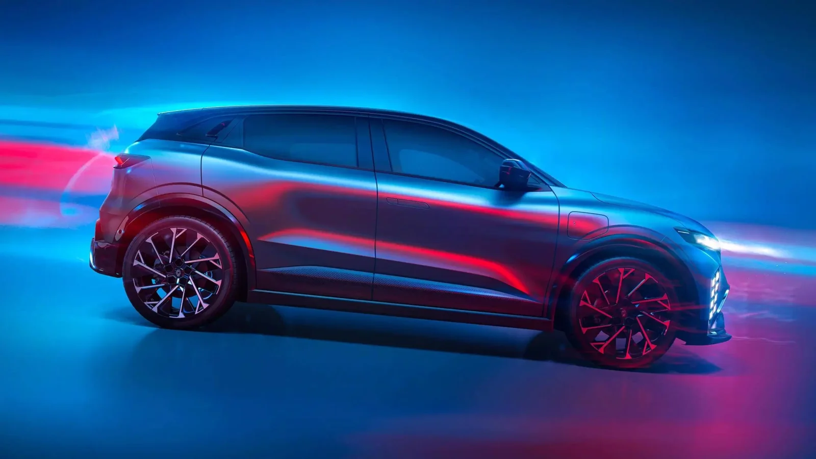 2027 Renault Megane E-Tech esprit Alpine side profile in a studio, showing its large diamond-cut alloy wheels