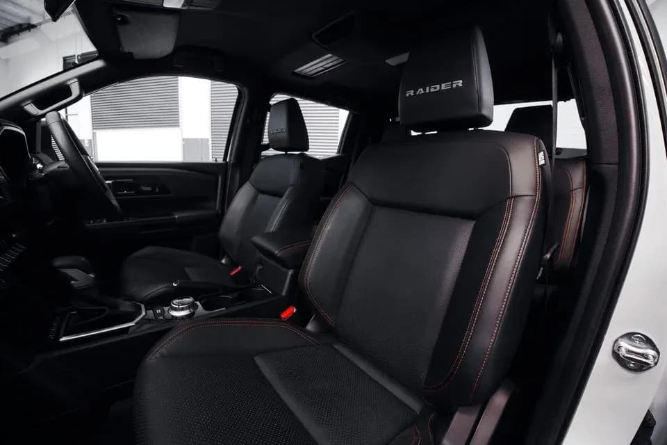 Triton Raider front seats showing Raider headrest embroidery