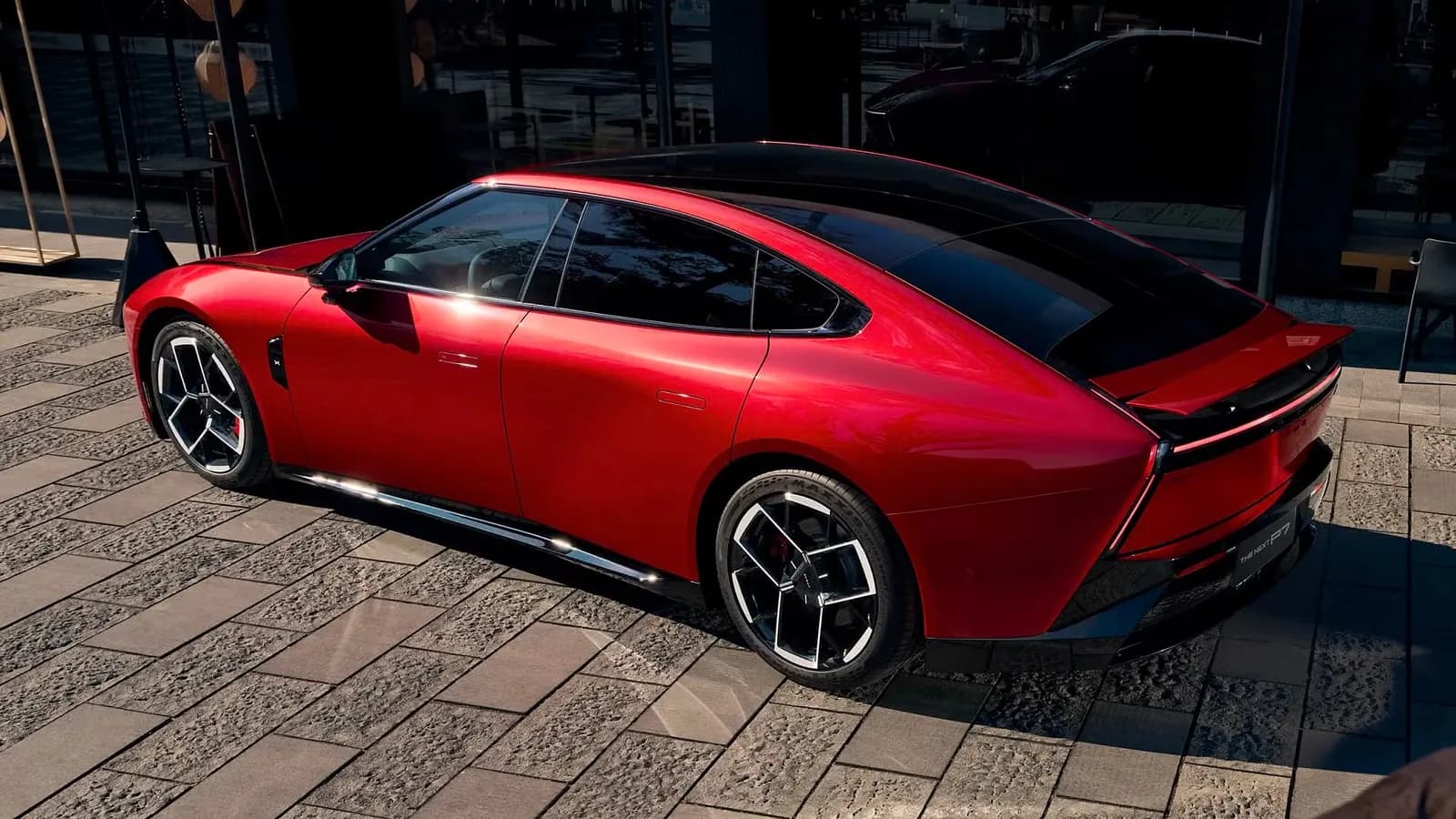 XPeng P7 electric sedan in red, rear three-quarter view