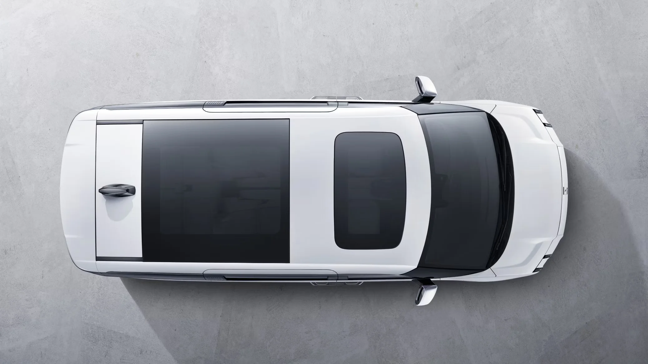 Zeekr 009 top-down view showing full-length panoramic glass roof