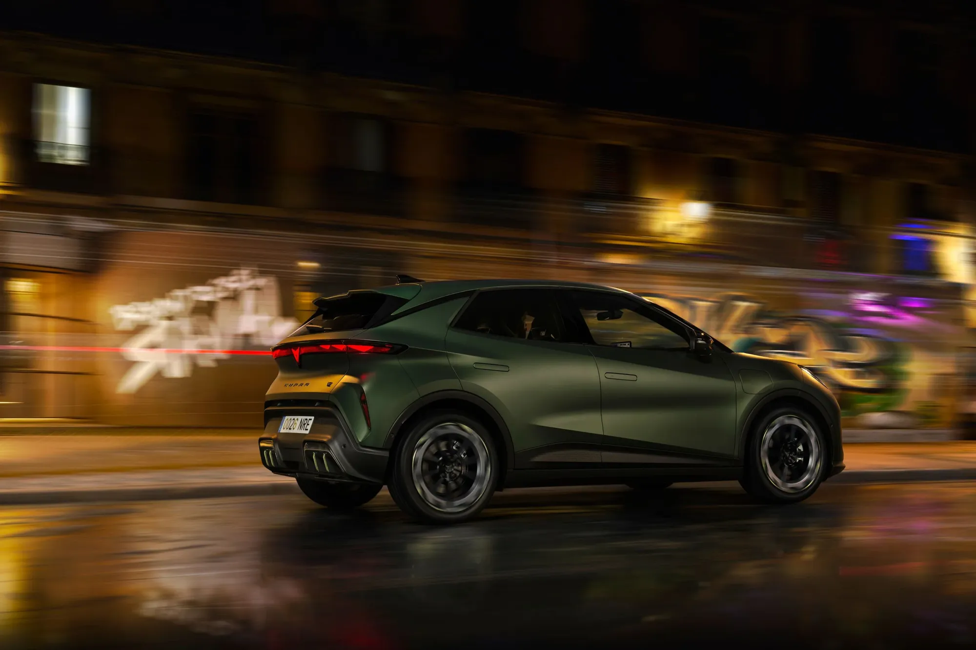2026 Cupra Raval rear three-quarter driving at night