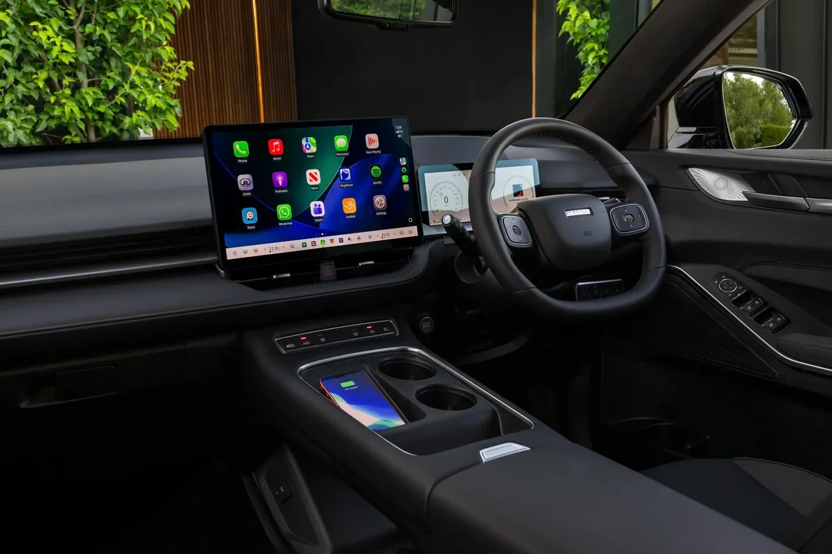 2026 GWM Haval H6GT Hi4 PHEV interior with 14.6-inch Coffee OS touchscreen and wireless phone charger