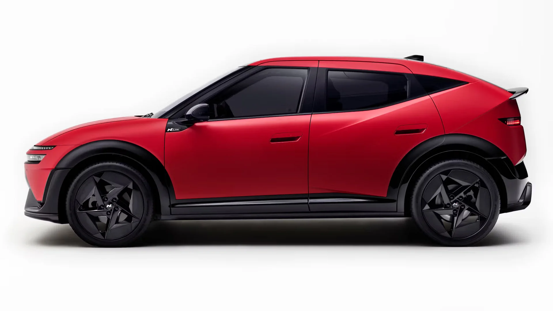 2027 Hyundai Ioniq 3 N Line in red, side profile showing fastback roofline and 19-inch wheels