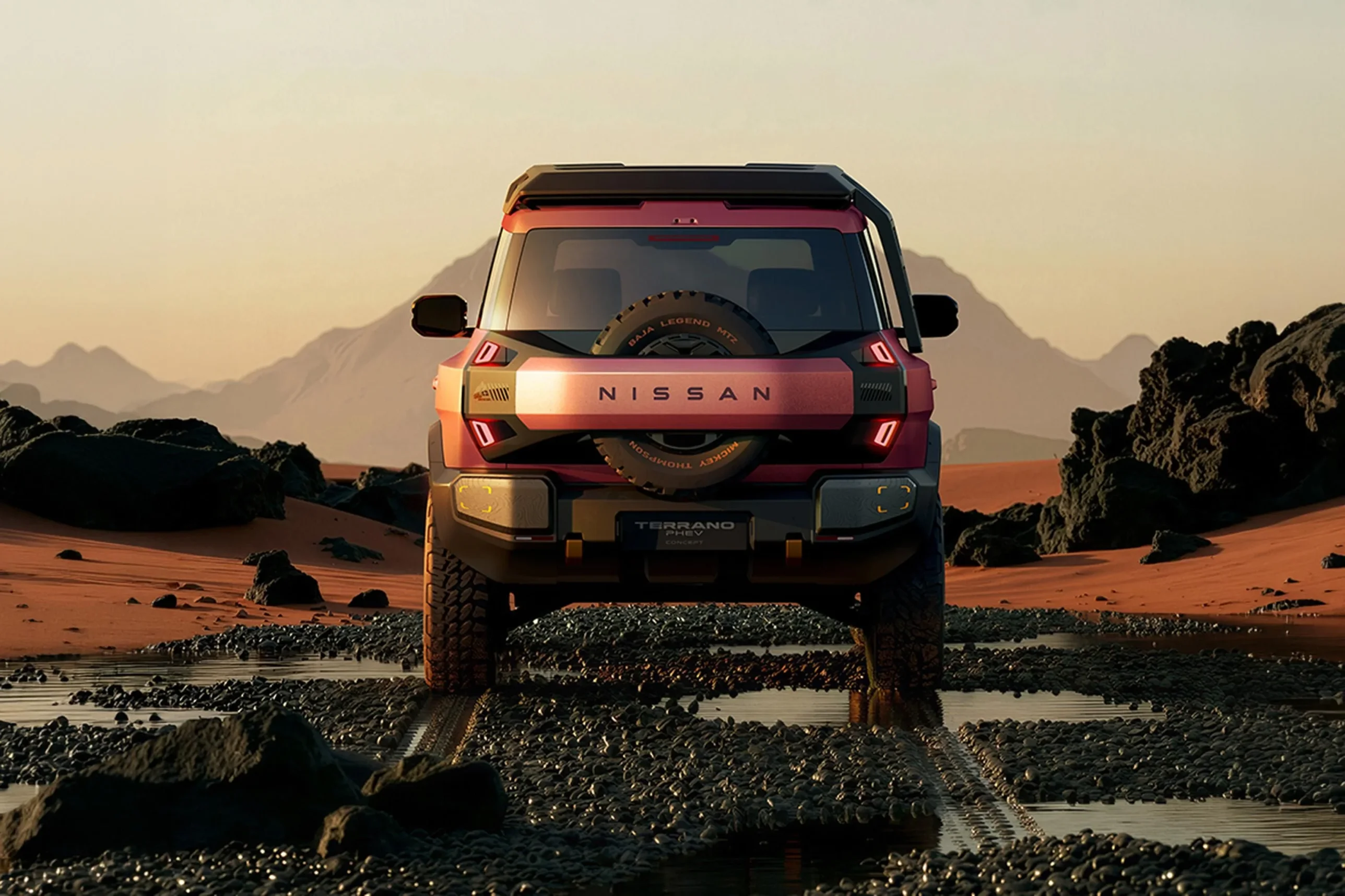 Nissan Terrano PHEV rear view showing tailgate-mounted spare wheel and Nissan name across boot