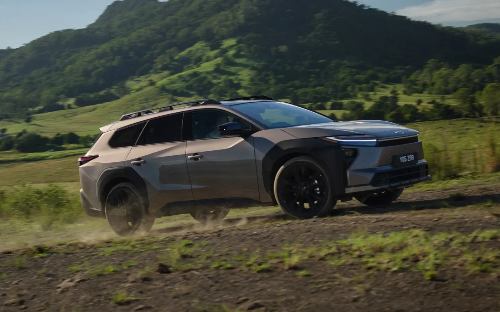 Toyota bZ4X Touring driving on a dirt road through Australian countryside