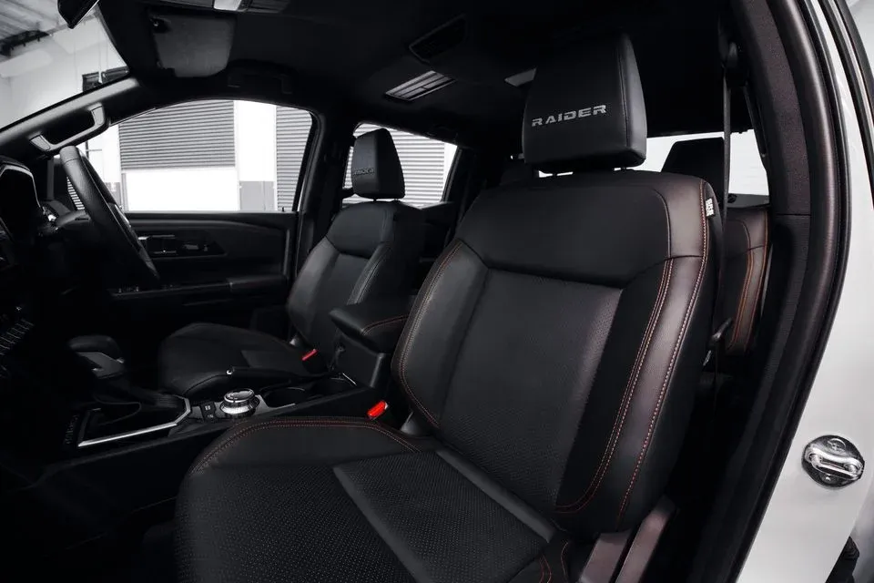 Triton Raider front seats showing Raider headrest embroidery